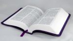 Open Bible Isolated On A White Background Stock Photo