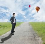 Businessman Standing On Rough Way Stock Photo