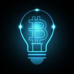 Bitcoin With Light Bulb Stock Photo