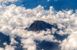 View From Airplane Window To Volcano Mountain Stock Photo