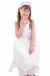 Little Girl Wearing White Dress And Posing On Chair On White Bac Stock Photo