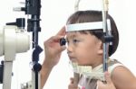 Small Boy With Slit Lamp Microscope Stock Photo