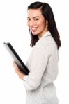 Female Assistant Holding Business Files Stock Photo