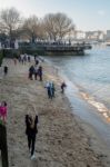 People Playing On The Beach On The Southbank Of The River Thames Stock Photo