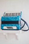 Blue Accordion In White Room Stock Photo