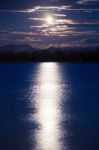 Full Moon Shining Down On The River Stock Photo