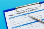 Health Insurance Claim Form With Pen Stock Photo