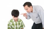 Father Threatening His Son Stock Photo
