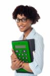 Young Businesswoman With Calculator And File Stock Photo