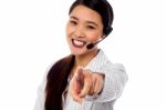 Call Centre Support Staff Pointing Towards Camera Stock Photo