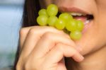 Woman Eating Green Grapes Friut Stock Photo