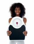 African Lady Showing Weighing Scale Stock Photo