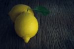 Fresh Lemon On Old Wood Stock Photo