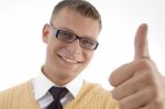 Smiling Student Showing Thumb Up Stock Photo