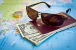 Sunglasses, Passport, Money And Compass On The Map Stock Photo