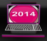 Two Thousand And Fourteen On Laptop Shows New Year 2014 Stock Photo