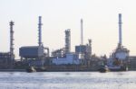 Oil Refinery Plant Beside River In Morning Light Stock Photo