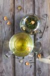 Mug Of Flavored Green Tea With Rose Buds And Petals Stock Photo