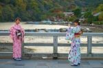 Japanese Girls Taking Photo At Togetsukyo Bridge Stock Photo