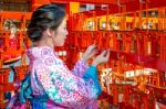 Women In Traditional Japanese Kimonos At Fushimi Inari Shrine In Kyoto, Japan Stock Photo