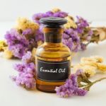Essential Oil With Flowers Stock Photo