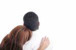 Back View Of Young Embracing Couple Look Into Distance Stock Photo