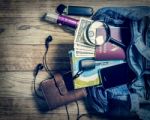 Necessary Object For Travelers In Denim Handbag Stock Photo
