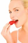 Woman Eating Strawberry Stock Photo
