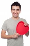 Casual Man Holding Heart Stock Photo