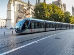 Tram Passing The Cathedral Of St Andrew In Bordeaux Stock Photo