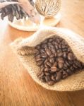 Coffee Roasted Bean On Wooden Table Vintage Style Stock Photo