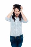 Frustrated Young Lady Screaming Loud Stock Photo