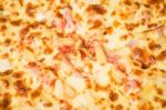 Delicious Pizza Pan With Cheese Crust Stock Photo