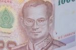 Close Up Of Thailand Currency, Thai Baht With The Images Of Thailand King. Denomination Of 1000 Bahts Stock Photo