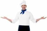 Smart Young Chef Welcoming Guests Stock Photo