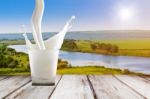 Close Up Of Milk Splash On Sunrise Background Stock Photo