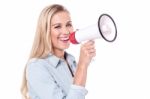 Enthusiastic Woman With A Megaphone Stock Photo