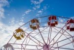 Close Up Part Of Pastel Ferris Wheel On Blue Sky Stock Photo