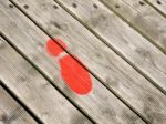 Red Painted Footprint On Southwold Pier Stock Photo