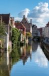 Buildings Alongside A Canal In Bruges West Flanders In Belgium Stock Photo