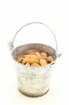 Almonds In Bucket Isolated On White Background Stock Photo