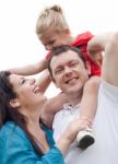 Portrait Of Cheerful Couple With Their Daughter Having Fun Stock Photo