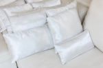 White Pillows On Bed Close Up Stock Photo