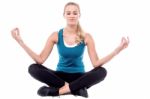 Athletic Woman Meditating. Lotus Pose Stock Photo