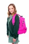 Smiling school girl carrying bag Stock Photo