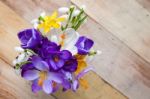 Bunch Of Spring Flowers. Crocus And Snowdrops On The Wooden Back Stock Photo