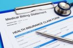 Health Insurance With Medical Bills Stock Photo