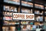 Coffee Shop Signboard With Cafe Blurred Background Stock Photo