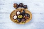 Fresh Mangosteen From Thailand In The Bamboo Basket Stock Photo