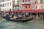 Gondolier In Venice Stock Photo
